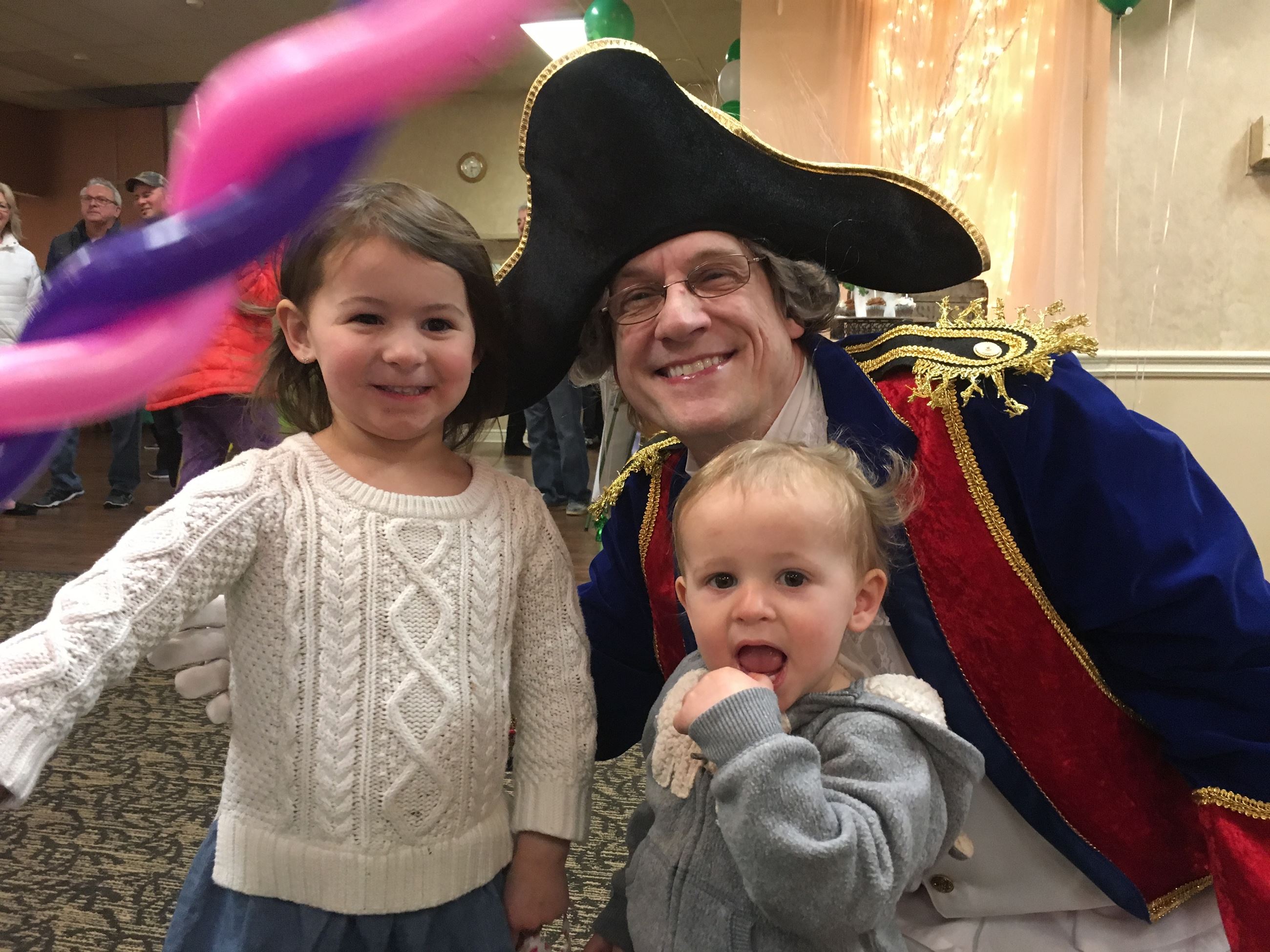 Man in Marquis de Lafayette costume with two little girls