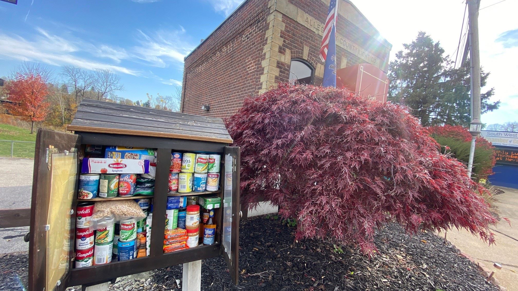 Little food pantry in front of chamber building